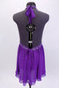Purple chiffon baby doll top has triangle bust area with beaded lace under bust line and at base of ties. The ties are an extension of the bust area and tie behind neck. Comes with matching purple shorts and floral hair accessory. Back