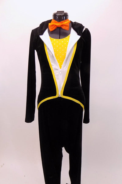 Black 3 piece costume has leotard with padded tummy & yellow front bib. Comes with black velvet harem  pants,silver hooded tailcoat with beak & orange bow-tie. Front full
