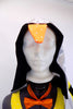 Black 3 piece costume has leotard with padded tummy & yellow front bib. Comes with black velvet harem  pants,silver hooded tailcoat with beak & orange bow-tie. Hood with beak