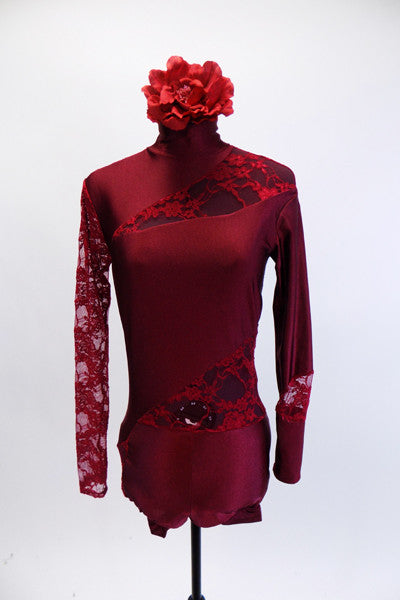 Deep red short unitard has high collar and long sleeves. The entire back and right sleeve is comprised of floral lace with matching insert lace panels at left shoulder, left hip and left wrist. Comes with deep red matching rose hair accessory. Front