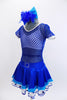 With sparkle bra top sits below a large weave blue mesh dress with white piping. The attached shimmery skirt has an aqua ruffle and a white petticoat with blue stars. Comes with matching hair accessory. Side
