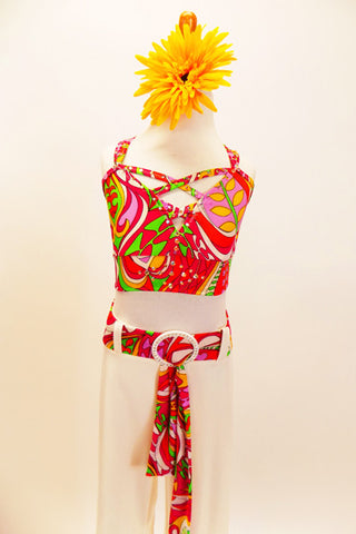 Funky patterns of red-green-pink-yellow-orange are the base if the criss-cross strapped half top with Swarovski accents. Comes white faux leather groove pants which has the matching funky belt with large crystal buckle. Comes with large yellow daisy hair accessory. Front zoom