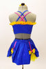Blue bra top with yellow ruffle & large bow accent. The matching skirt is a blue overlay with  of yellow  petticoat & bows accents. Has floral hair accessory. Back