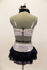 White & silver sequin bandeau bra top has front loop with navy halter collar. The briefs are separate from navy sequined lace skirt. Comes with hair accessory. Back