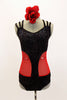 Unique leotard is black sparkle extending down  front center, brief area & mid back. The sides are red mesh & straps cross at back.Comes with hair accessory. Front