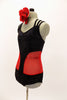 Unique leotard is black sparkle extending down  front center, brief area & mid back. The sides are red mesh & straps cross at back.Comes with hair accessory. Side
