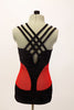 Unique leotard is black sparkle extending down  front center, brief area & mid back. The sides are red mesh & straps cross at back.Comes with hair accessory. Back