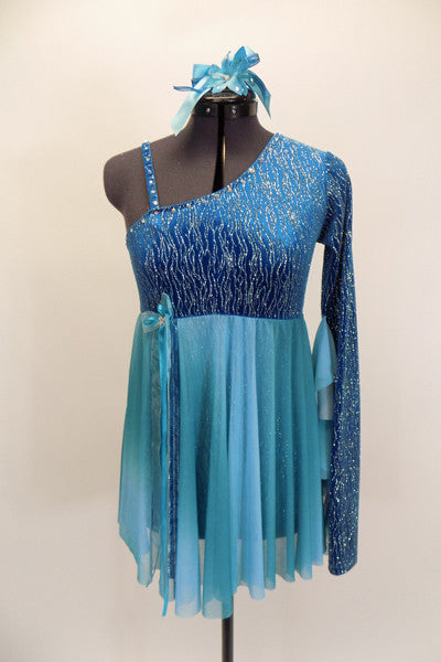 Turquoise glitter-velvet, one shoulder A-line dress with single long sleeve, has soft chiffon draping extending to wrist. Chiffon skirt fades from dark to light aqua and had bow accent on right waist. Comes with matching hair accessory. Front