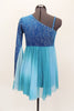 Turquoise glitter-velvet, one shoulder A-line dress with single long sleeve, has soft chiffon draping extending to wrist. Chiffon skirt fades from dark to light aqua and had bow accent on right waist. Comes with matching hair accessory. Back