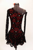 Red shimmery base one shoulder dress has  gathered skirt and black lace overlay with Swarovski accents throughout. The single sleeve and long gauntlet are both sheer black lace and accented with crystals. Comes with a matching red and black hair accessory. Back
