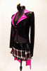 Black tailcoat has shimmery hot pink ling crystal covered lapels. It is secured in the front bay two crystal covered straps. The skirt is a pink-black and white tartan print with wide sequin belt. Comes with matching hair accessory Left side