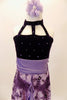 Purple dress has open front skirt with purple pansies over lavender base  Bodice is dark purple crystalled velvet with front straps. Comes with hair accessory. Front zoomed
