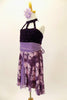 Purple dress has open front skirt with purple pansies over lavender base  Bodice is dark purple crystalled velvet with front straps. Comes with hair accessory. Side
