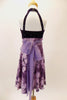 Purple dress has open front skirt with purple pansies over lavender base  Bodice is dark purple crystalled velvet with front straps. Comes with hair accessory. Back
