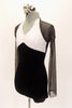 Black velvet short unitard has white halter sequined bust and a separate sheer black sparkle mini shrug. Comes with matching hair accessory. Side