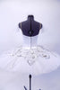 White tutu has 10 layers of crisp  pleated tulle and ruffled panty. The satin bodice with hook & eye closure is attached to bask. The Silver sequined lace overlay is an overlapping star shape. The bodice has matching sliver sequined lace painted swirls, silver trim and large drop crystal. There is a mesh insert in deep sweetheart neckline. Comes with crystaled tulle arm bands and a matching hair accessory. Back