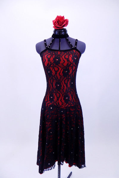 Spanish flare red and black lace dress has long flowing circle skirt bottom attached to camisole style top with velvet crystaled strap accent that join to black choker collar. Comes with floral hair accessory. Front