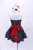 Halter style, black & white polk-a-dot leotard with white sparkle collar, has matching skirt with petticoat. Comes with a white sequined apron with red heart and large red hair accessory. Back