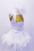 Gold bra top sits below an open front white velvet halter leotard dress. The skirt of the dress is edged with white boa feathers. The leotard has scattered crystals and a large white hair accessory. Side