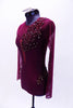Maroon leotard has sheer long sleeves, back, sides and upper bust. The front bodice with deep “V” sweetheart neckline and bottom are a maroon lycra. A large applique extends from the left shoulder and covering left bust. Two additional appliques hug the hip curves on both sides below mesh.  The appliques are adorned with sequins, pearls and Swarovski crystals.  Comes with crystal barrette. Side