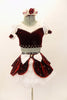 2 piece costume is burgundy velvet & white stretch lace with pouf sleeves & bow accents. Skirt has white petticoat with velvet overlay & many crystals. Comes with matching hair accessory. Front 