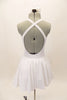 White, halter leotard dress has cross straps, low back & waistband separating the bust area & gathered skirt with tulle. Comes with floral hair accessory.Back