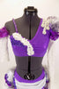 Costume has one lace sleeve, one lace gauntlet ruffled shoulder & rows of pearls. Purple bra has applique & white pearl ruffle. Matching bottom has layered bustle in white, silver & purple. Front zoomed