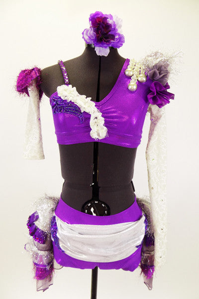Costume has one lace sleeve, one lace gauntlet ruffled shoulder & rows of pearls. Purple bra has applique & white pearl ruffle. Matching bottom has layered bustle in white, silver & purple. Front
