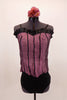 Two piece costume is mauve textured silk corset style top with black vertical ribbon inlay, satin ruffle trim & hook-eye closure. Comes with black brief bottom and floral hair accessory. Front