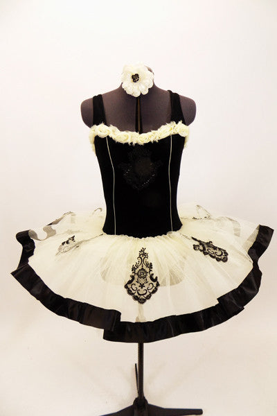 Black velvet  leotard is decorated with ivory  rose lace. Tutu is layers of ivory tulle with black satin edge & lace lace appliques.Comes with hair accessory. Front