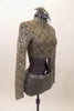 Taupe-grey lace sequined long-sleeved half top has high neck collar. Top is accompanied by matching glitter briefs and a feather and glitter hair accessory. Right side