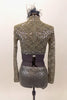 Taupe-grey lace sequined long-sleeved half top has high neck collar. Top is accompanied by matching glitter briefs and a feather and glitter hair accessory. Back