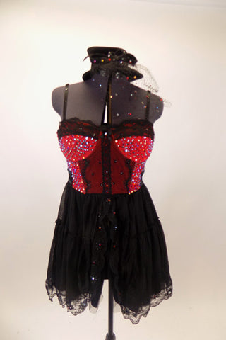 Red and black bustier dress has crystaled lace edging on skirt. Bustier has lace torso & bust. & hundreds of  Swarovski crystals. Comes veiled top-hat accessory Front