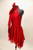 Red high neck, halter dress has attached skirt in layers of red chiffon. There is an attached red jeweled necklace and large satin bow that sits on right shoulder. Comes with red, crystaled hair accessory. Left side