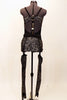 Black mesh leotard has silver patterned inlays at bust, torso & sides lined with silver crystals. Has  pull on garter belt with attached stirrups & hair piece. Back