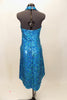 Bright aqua, fully sequined halter dress, has cross-over bodice as well as cross-over skirt with peek-a-boo front.  Comes with applique hair accessory.  Back