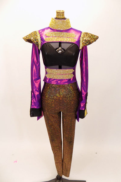 Purple  tailcoat has high collar & open torso. Neck, front & wrists have gold rhinestone mesh. Has gold padded shoulders, black bra, gold leggings & hair piece. Front