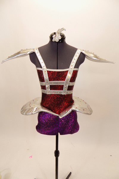 Red & purple short unitard has silver cage-like crystaled strap accents on torso that double as straps. Shoulders & hips have silver padded, embellishments. Front