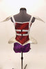 Red & purple short unitard has silver cage-like crystaled strap accents on torso that double as straps. Shoulders & hips have silver padded, embellishments. Back