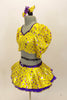 Bright yellow base with purple star print half top has large pouf sleeves with crystaled purple piping. Matching skirt has purple petticoat & bow hair accessory Left side