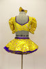Bright yellow base with purple star print half top has large pouf sleeves with crystaled purple piping. Matching skirt has purple petticoat & bow hair accessory. Back