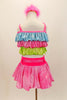 Pastel costume has tri-colored top in layered ruffles of glittery blue pink and green. The skirt is glittery pink with bright pink waistband and decorative pink crystal buckled belt. Comes with pastel pink floral hair accessory. Back