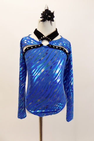 Blue leotard has zebra stripe design with black piping. Black velvet collar attaches to ring at center of chest. Leotard & shrug are also joined to same ring. Front