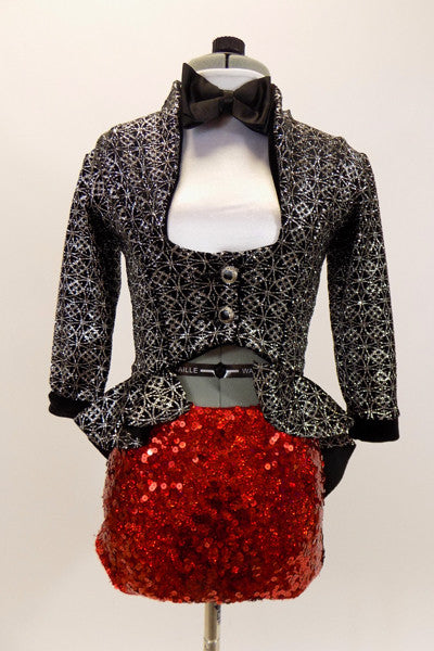 White  high collar crop sits below high waisted,black & silver peplum tailcoat. The bottom is red sequined brief . Has black bow-tie & sequined black top hat. Front