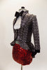 White  high collar crop sits below high waisted,black & silver peplum tailcoat. The bottom is red sequined brief . Has black bow-tie & sequined black top hat.  Left side