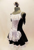 Black sateen French maid dress has princess seams with white center on bodice and attached white apron. The edge of the skirt, apron and bust has wide French lace trim. Comes with ruffled hair accessory & black gloves. Left side