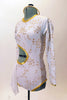Long sleeved white  leotard  has golden floral pattern, cut-out back & right side with 3 back straps. Has white chiffon kerchiefs at right hip & hair accessory. Left side
