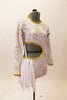Long sleeved white  leotard  has golden floral pattern, cut-out back & right side with 3 back straps. Has white chiffon kerchiefs at right hip & hair accessory. Right side