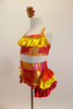 Iridescent yellow, red & orange costume has halter style top with yellow satin ruffle & shorts with layered bustle of red, yellow & orange satin ruffles. Comes with sequined hair accessory. Left side
