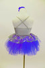 Silver camisole leotard dress has silver lace overlay. Lace peplum sit on the periwinkle blue tutu skirt. Has satin waist with bow & ruffle along bust & hair accessory. Side 